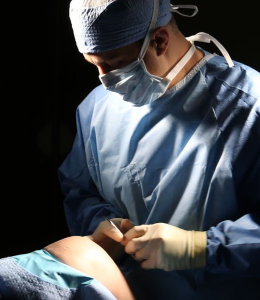 Orthopedic surgeon performing joint replacement surgery